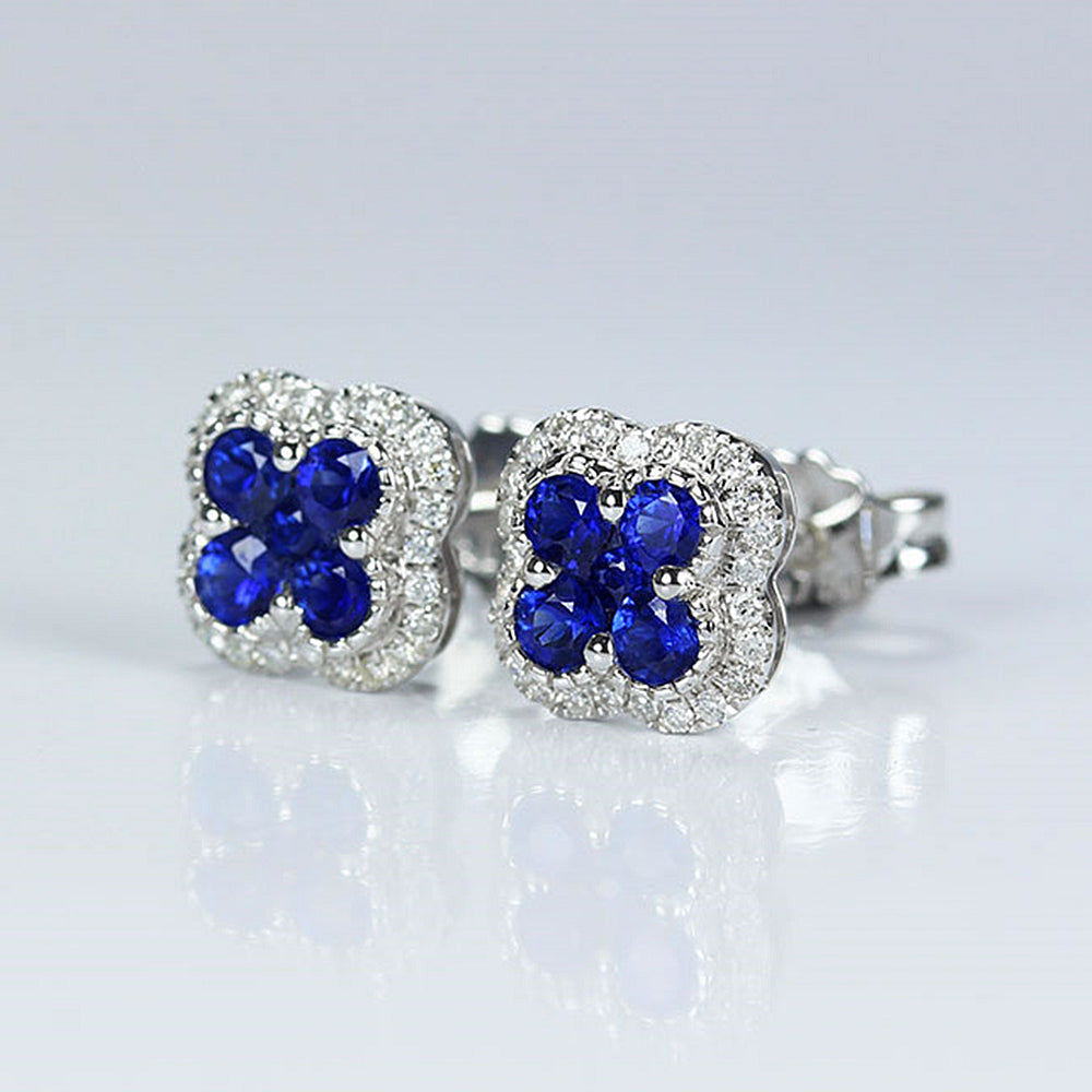 https://hxjewelry.com/cdn/shop/products/Sapphire_Quatrefoil_Clover_with_Diamond_Halo_Stud_Earrings_1.jpg?v=1669687237